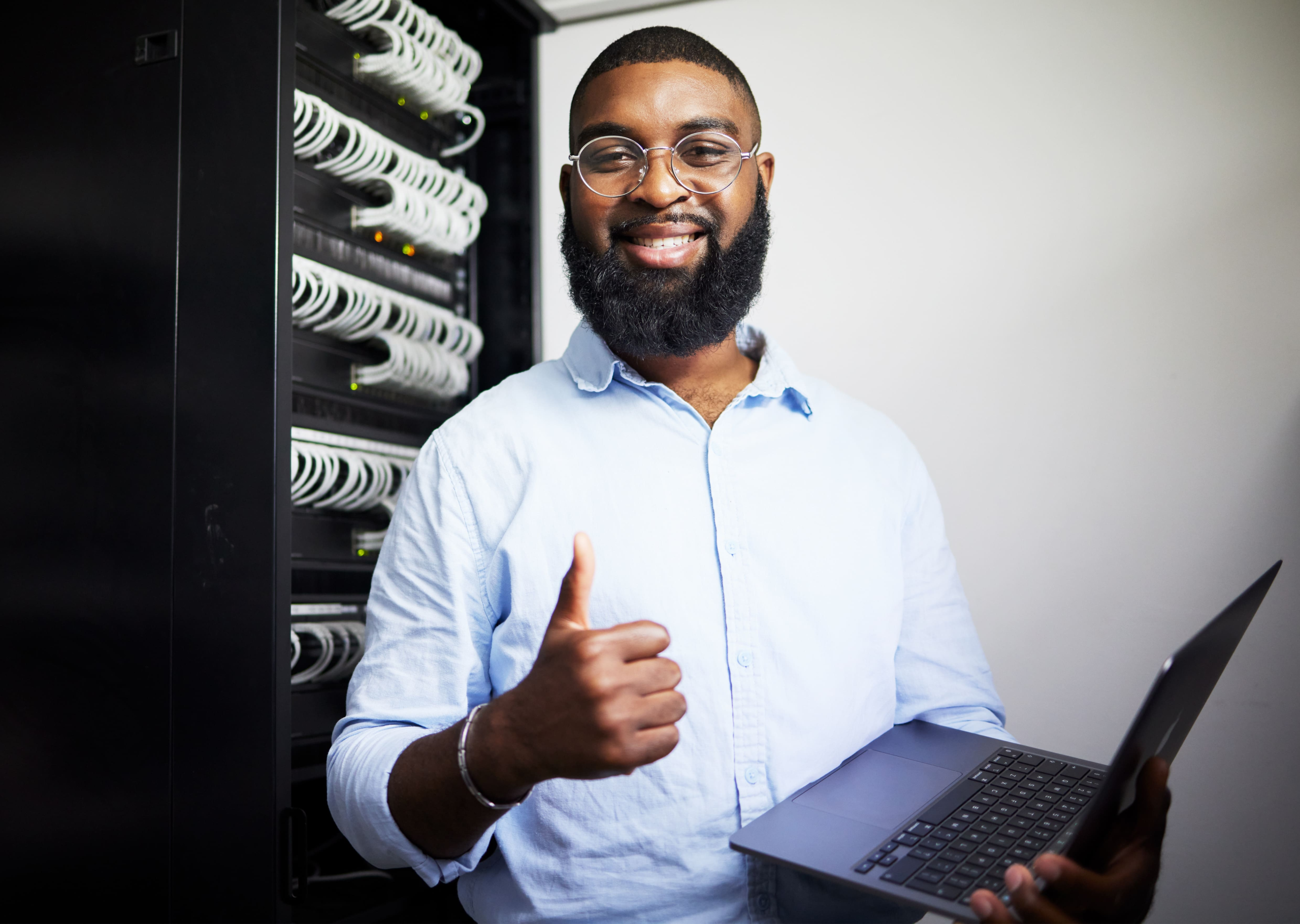 server-room-laptop-and-thumbs-up-with-technician-2025-04-06-10-37-04-utc